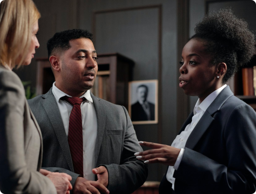 Two men and a lady discussing approach